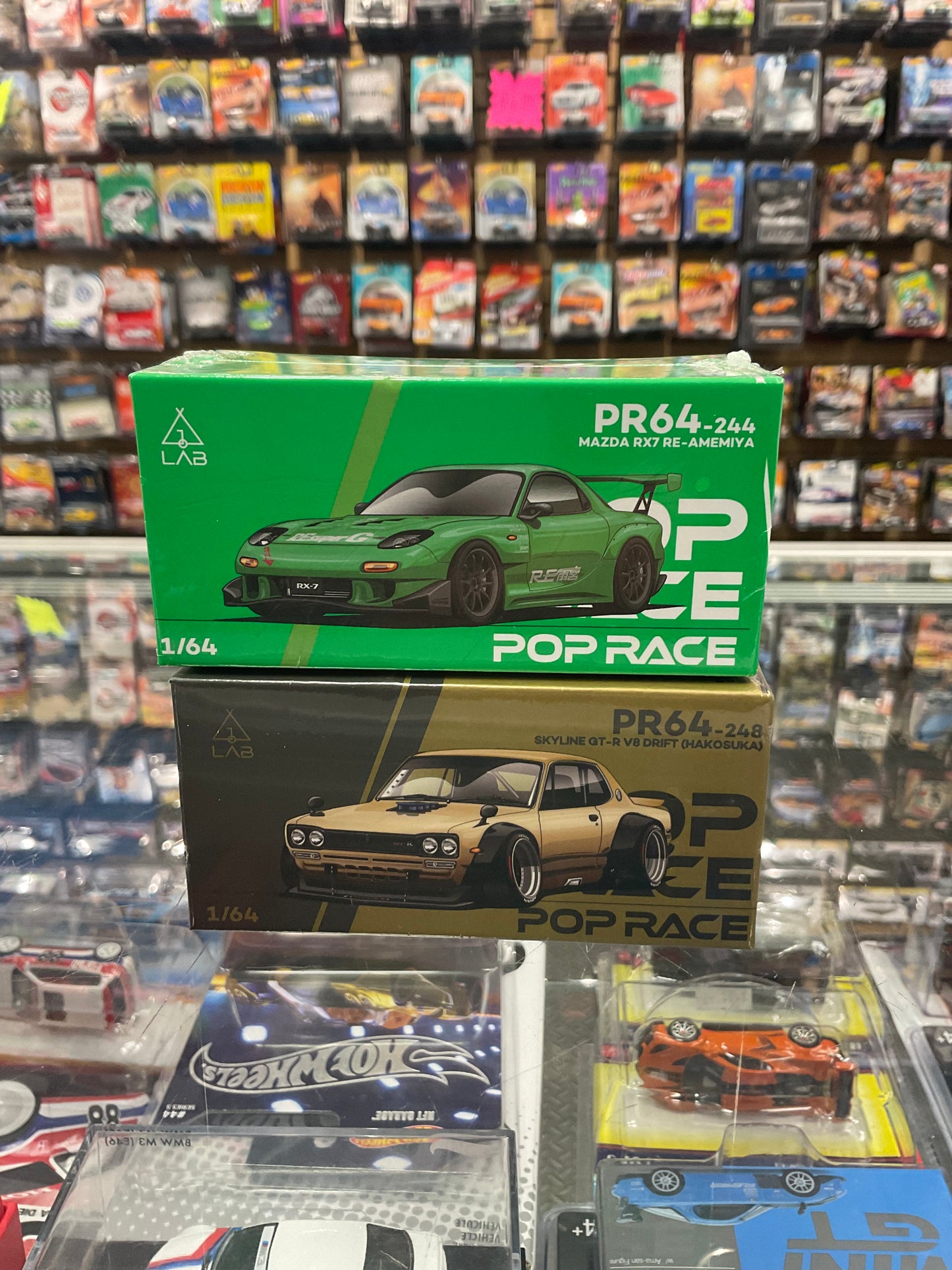Set of 2 Pop Race PR64-248 Skyline GT-R V8 Drift (Hakosuka) Gold and Pop Race PR64-244 Mazda RX-7 Re-Amemiya Widebody Green