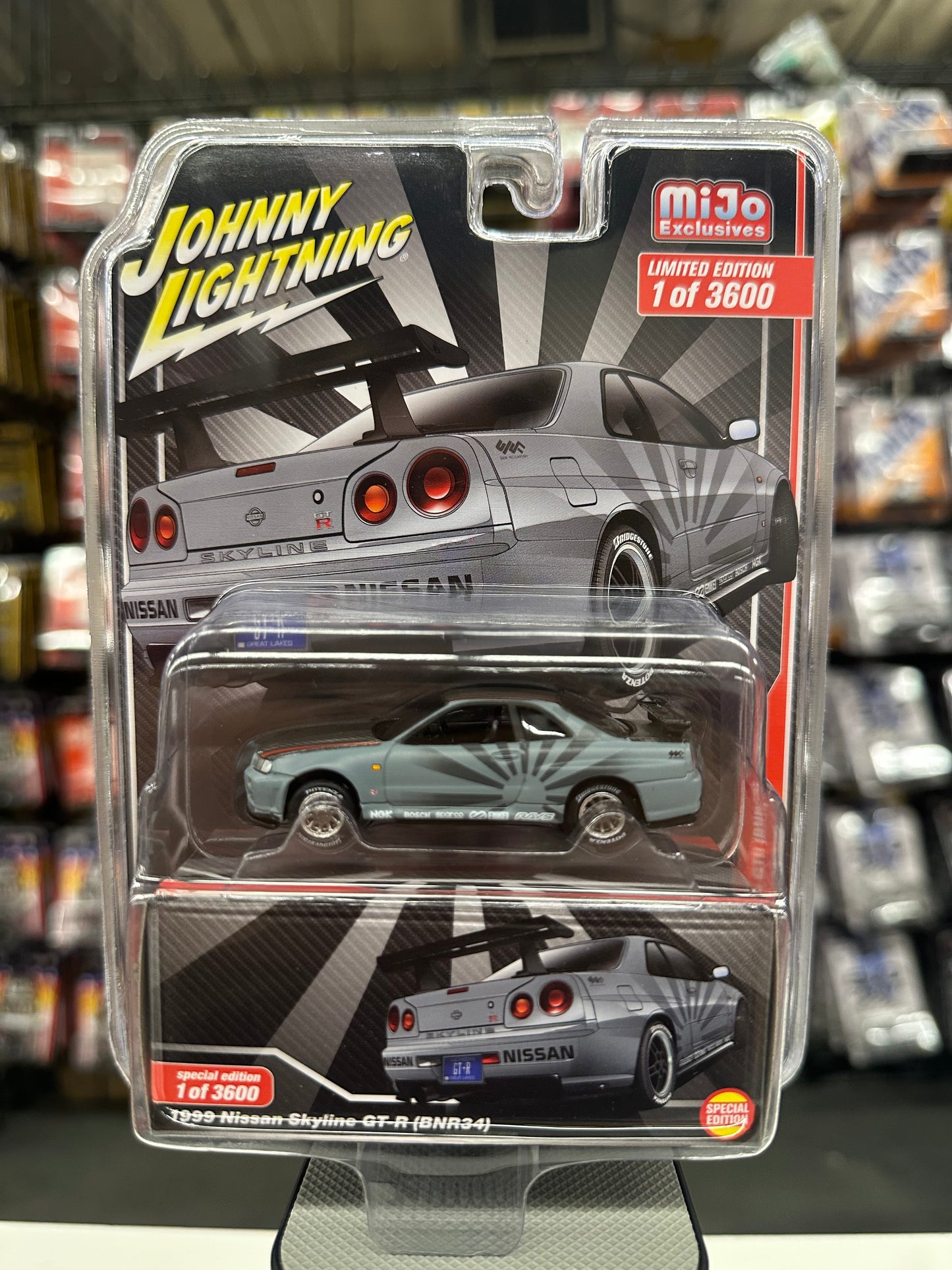 Johnny Lightning 1999 Nissan Skyline GTR (BNR34) Grey/Black Rising Sun