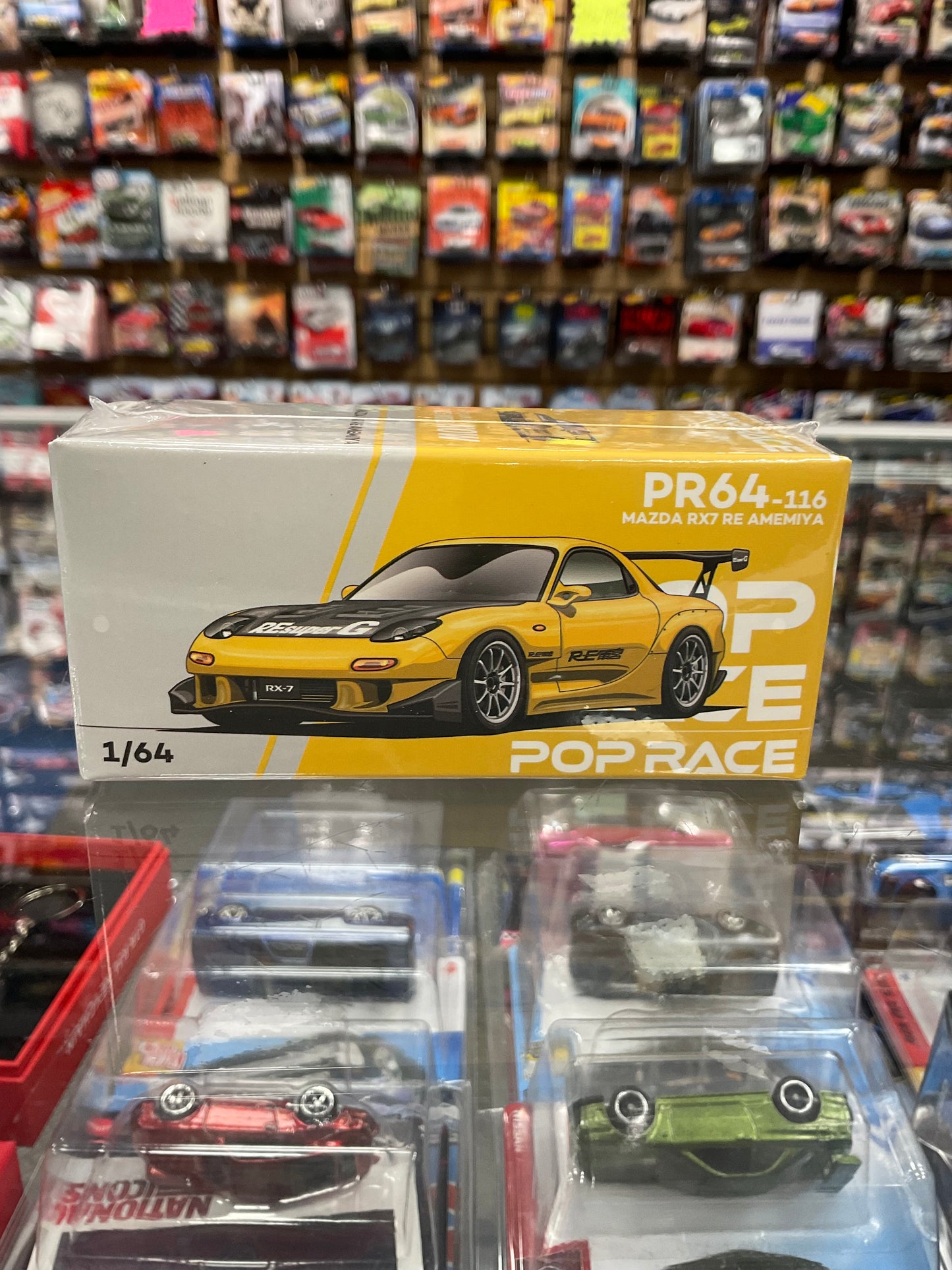 Pop Race PR64-116 Mazda RX7 RE Amemiya Yellow