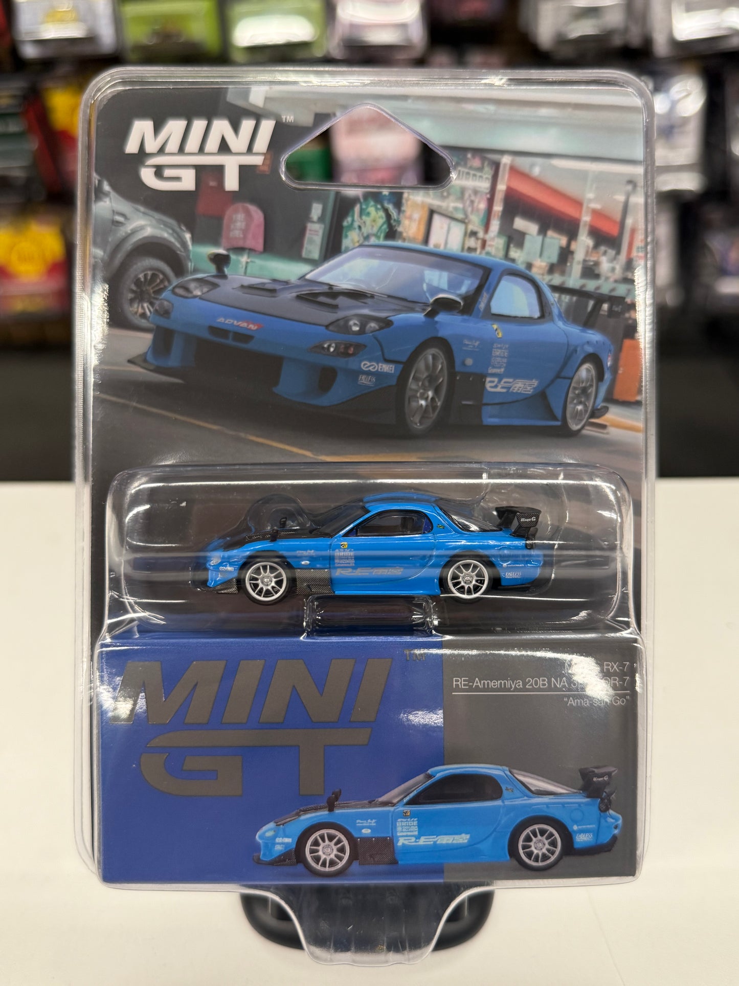Mini GT 1046 Mazda RX-7 RE-Amemiya 20B NA 3ROTOR-7 "Ama-san Go"