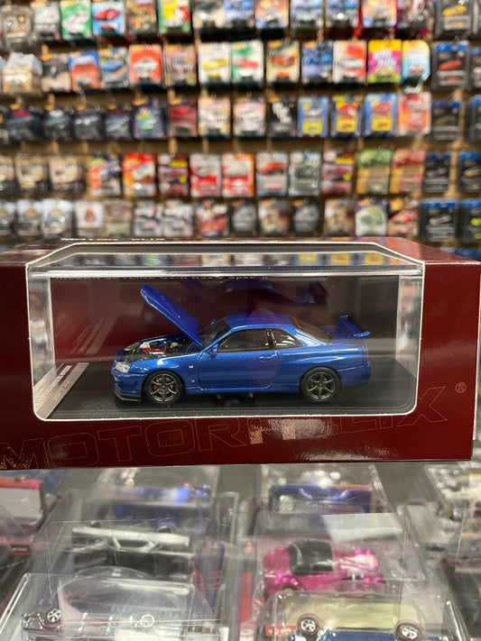 MotorHelix Nissan Skyline GTR R34 V Spec II opening hood blue