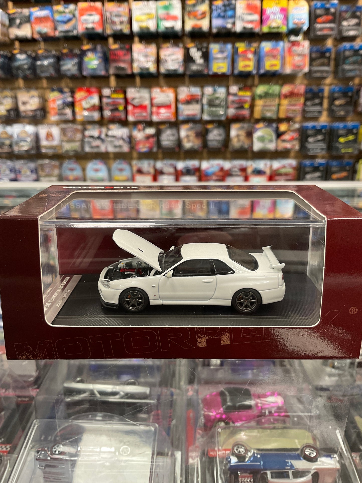 MotorHelix Nissan Skyline GTR R34 V Spec II opening hood White